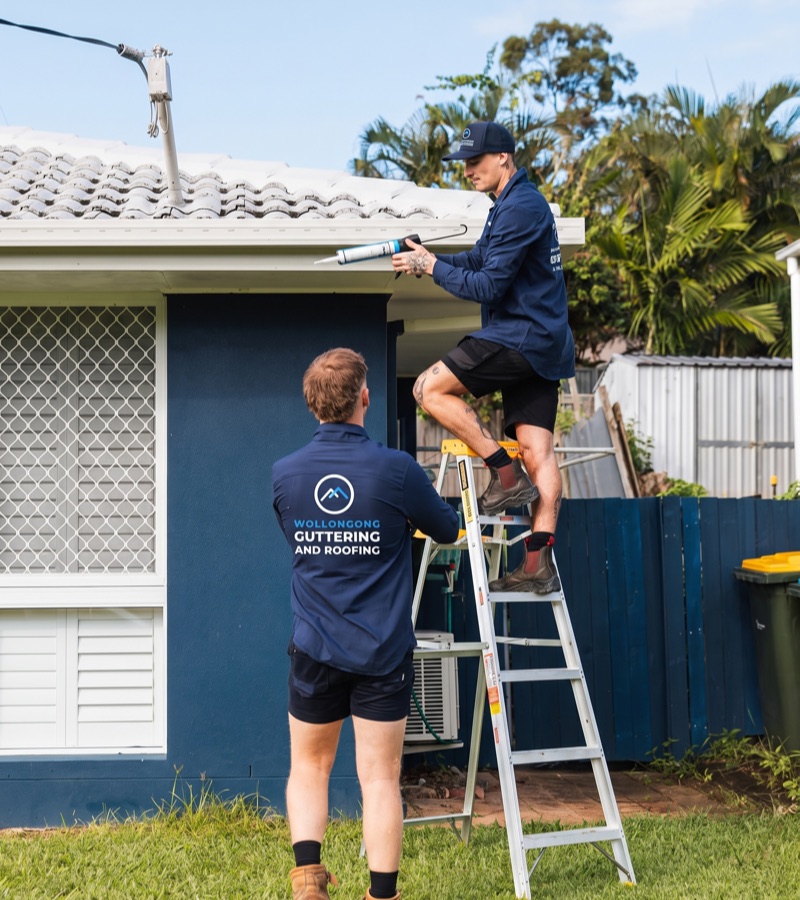 Roofers working on roof repairs